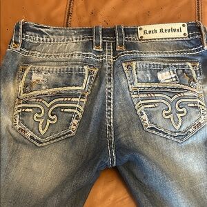 Rock Revival Faded Blue Jeans with Embroidered Pockets